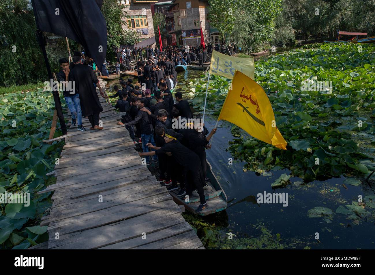 Kashmiri Shiite Muslims shout religious slogans as they participate in ...
