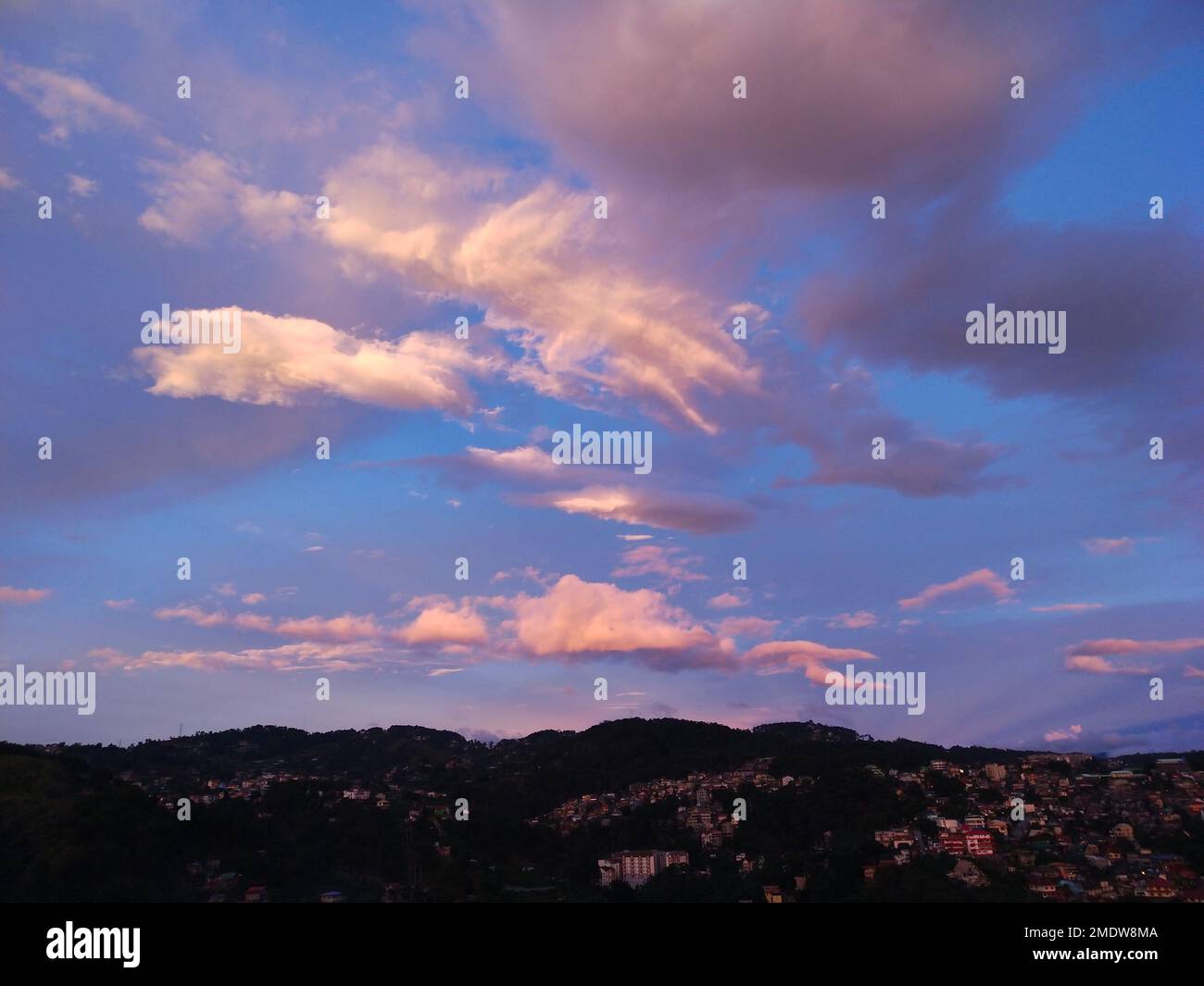 A beautiful sunset sky over the city Stock Photo - Alamy