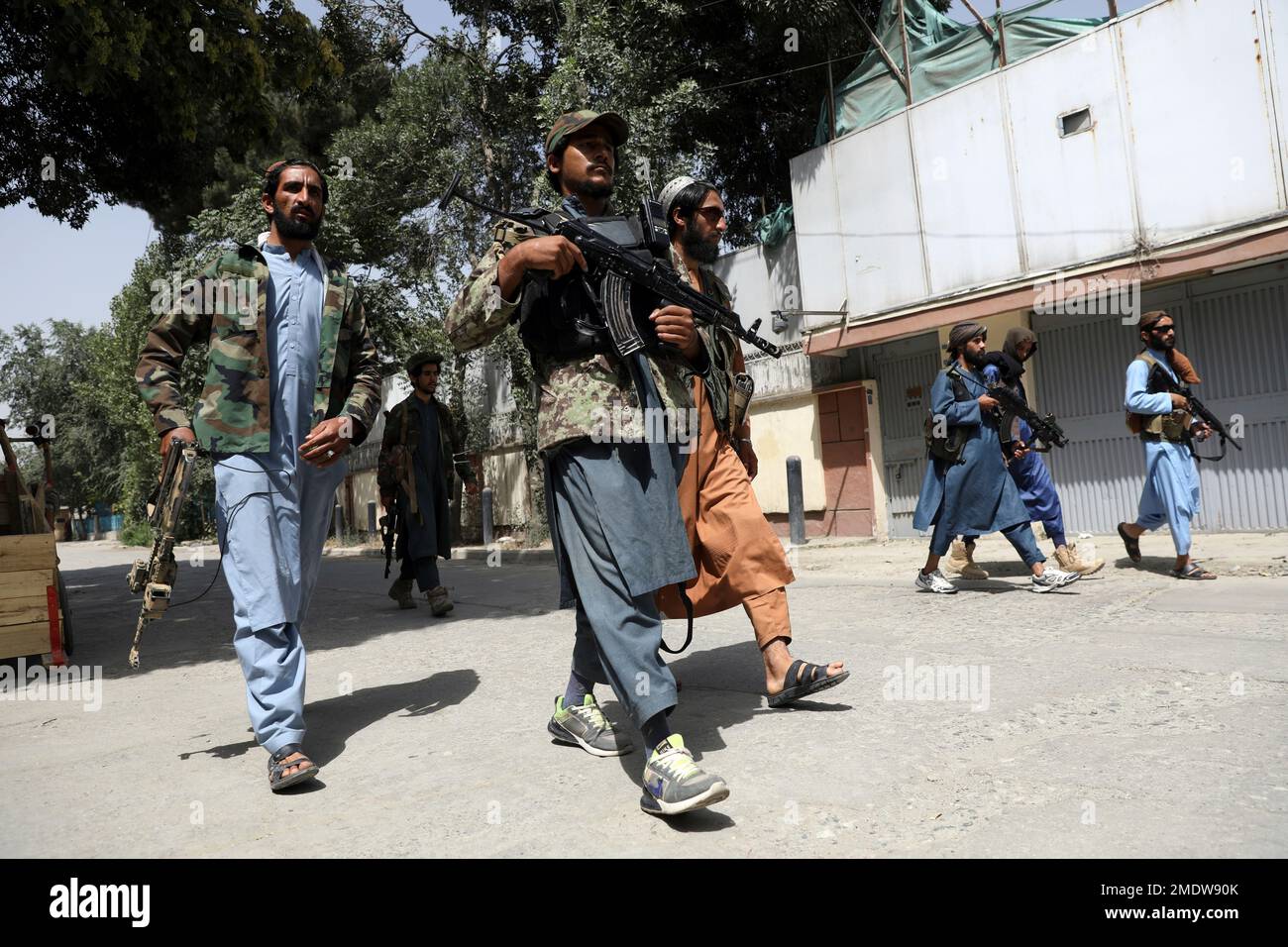 Taliban fighters patrol in the Wazir Akbar Khan neighborhood in the