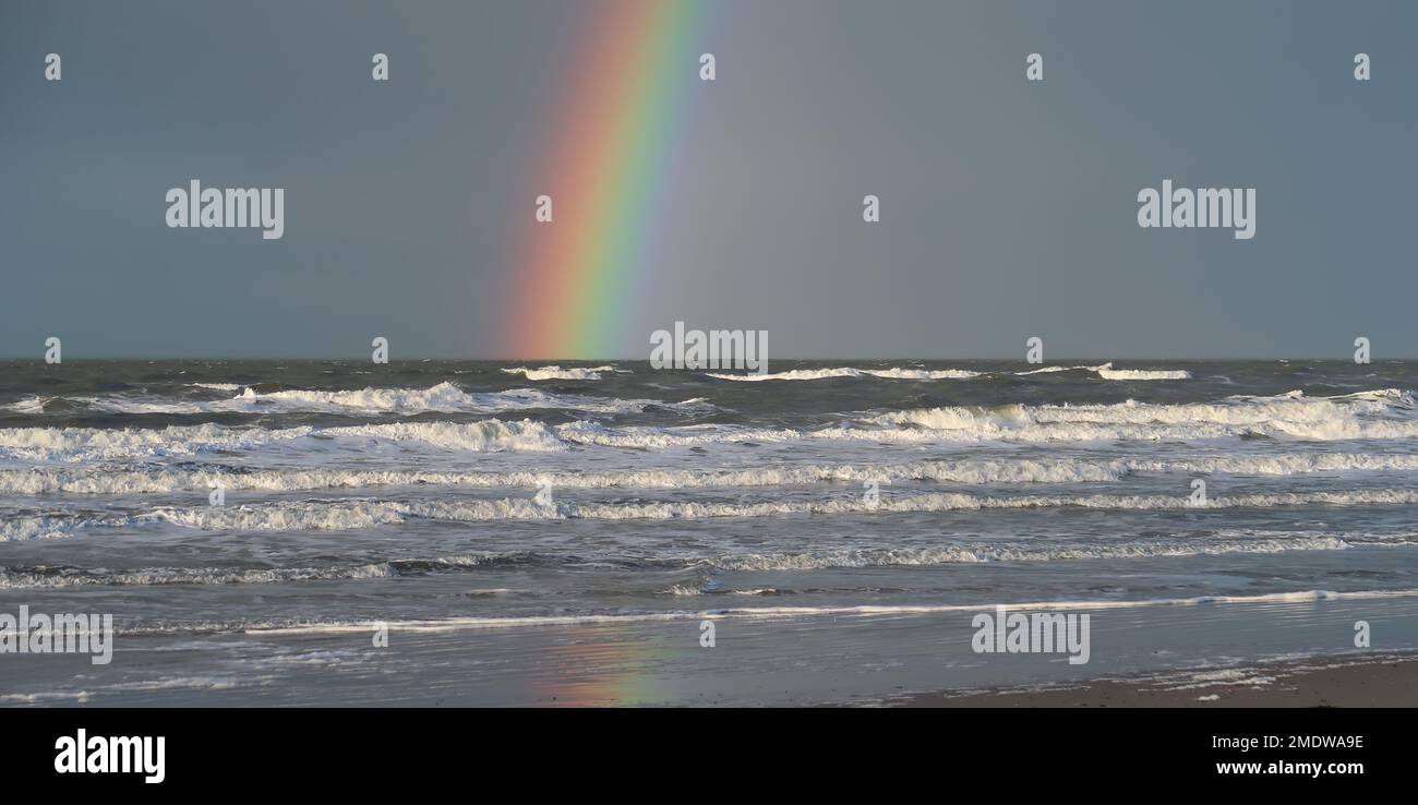 Rainbow over the ocean water Stock Photo - Alamy