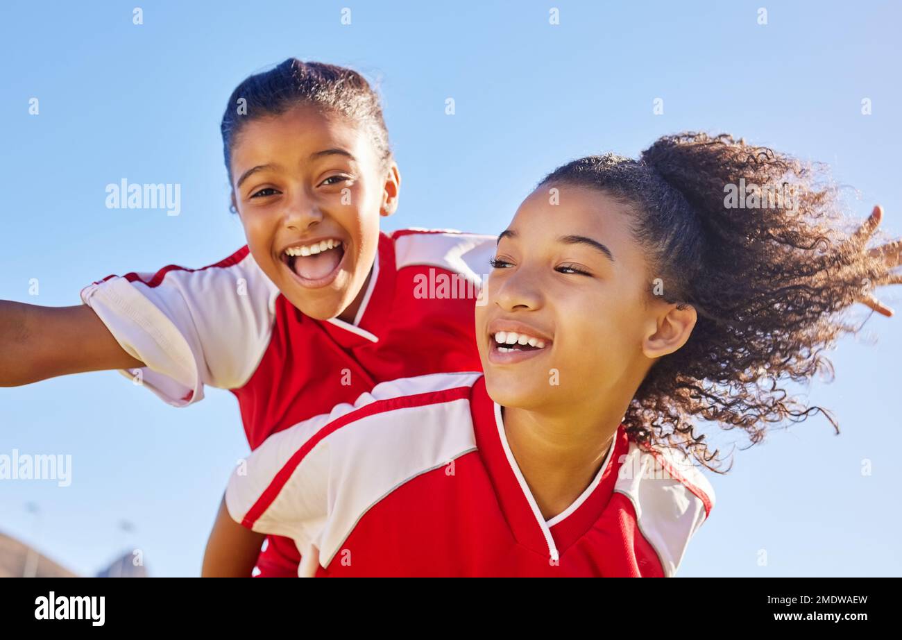 Sports soccer portrait, blue sky and happy kids excited for winning goal, competition success or fun challenge achievement. Winner, celebration and Stock Photo