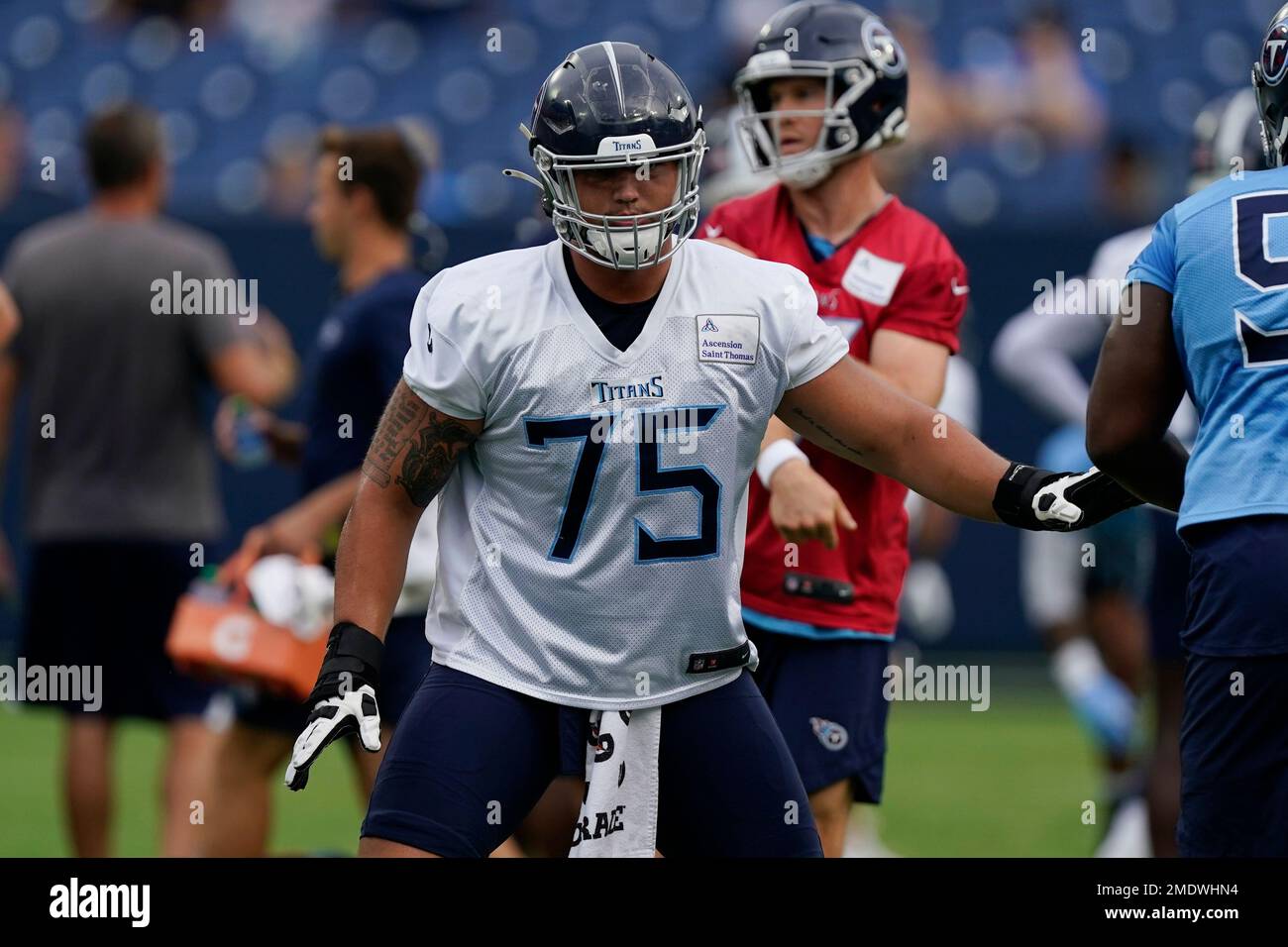 Tennessee Titans offensive tackle Dillon Radunz (75) runs a drill