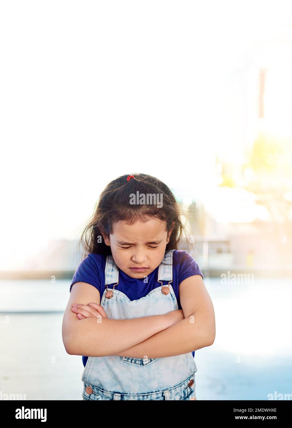 https://c8.alamy.com/comp/2MDWHXE/holding-back-tears-a-sad-little-girl-posing-eyes-closed-and-with-arms-folded-at-home-2MDWHXE.jpg