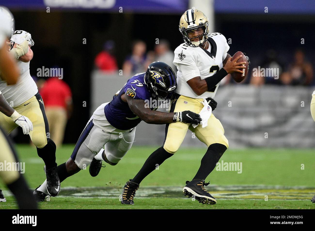 Baltimore Ravens linebacker Daelin Hayes (59) applies pressure on New  Orleans Saints quarterback Jameis Winston (2) during the first half of an  NFL preseason football game, Saturday, Aug. 14, 2021, in Baltimore. (