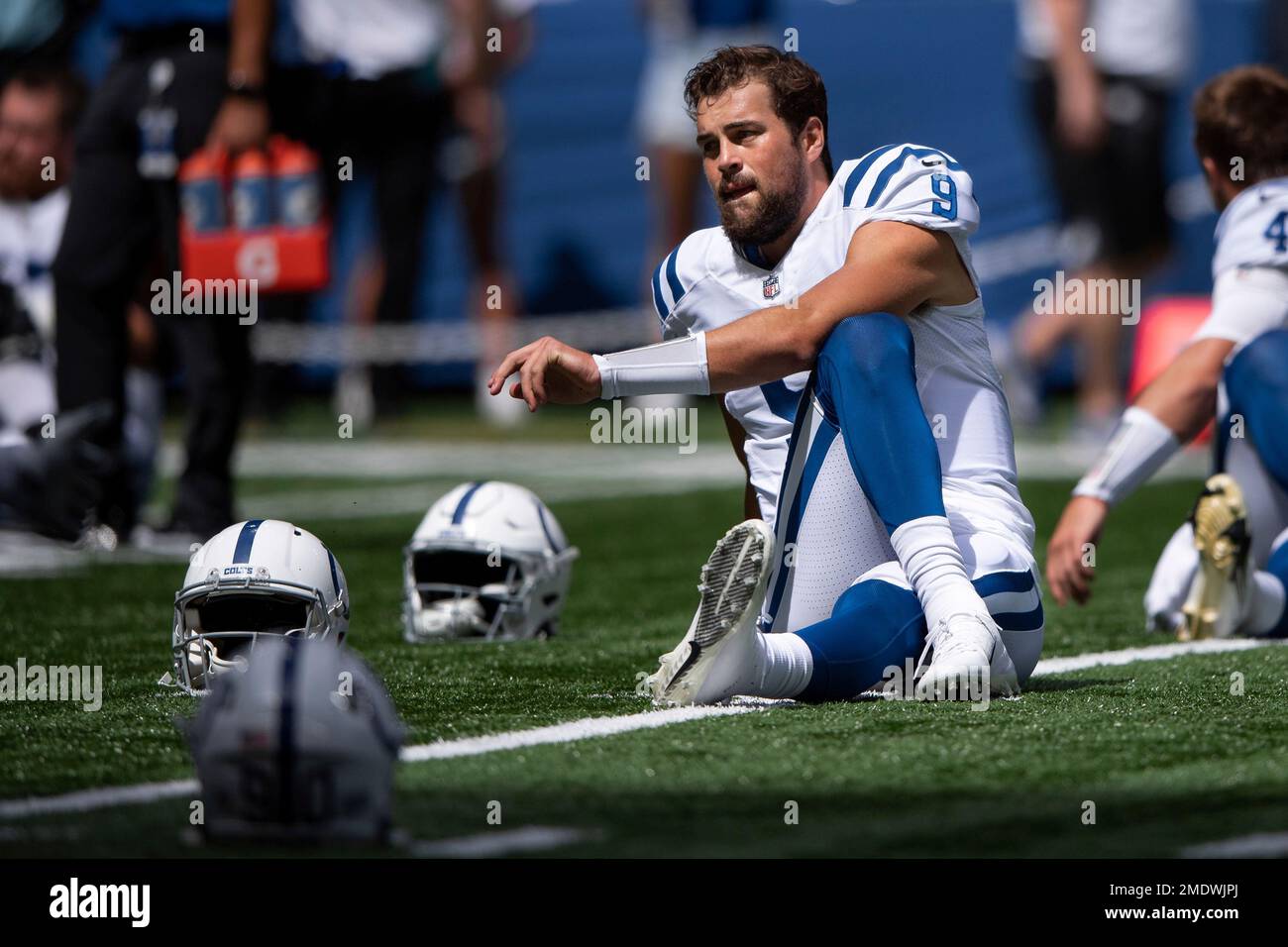 Indianapolis Colts quarterback Jacob Eason (9) stretches on the field