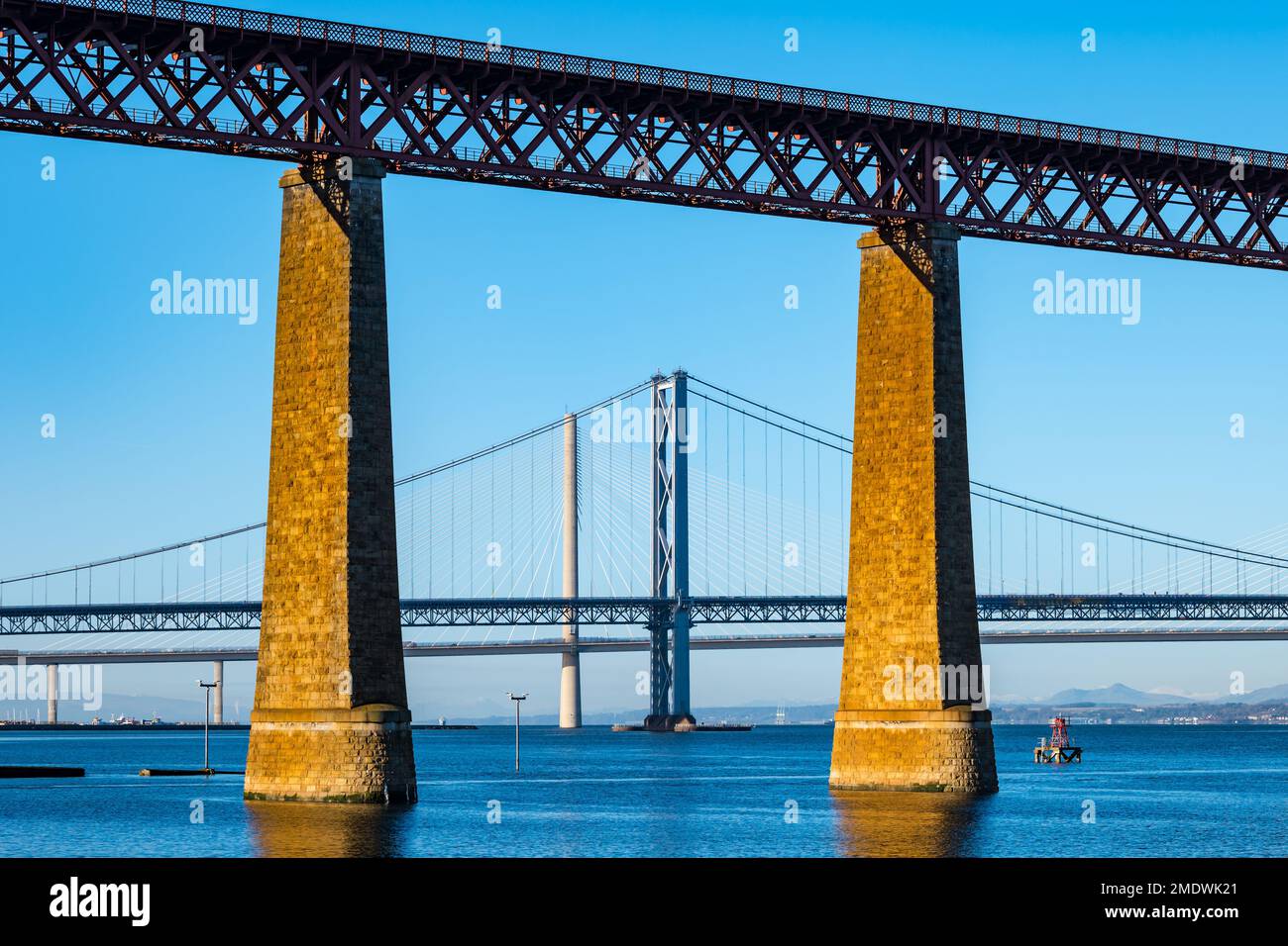 Forth bridges: Forth Rail bridge, Forth Road bridge and Queensferry Crossing on sunny day with clear blue sky, Firth of Forth, Scotland, UK Stock Photo