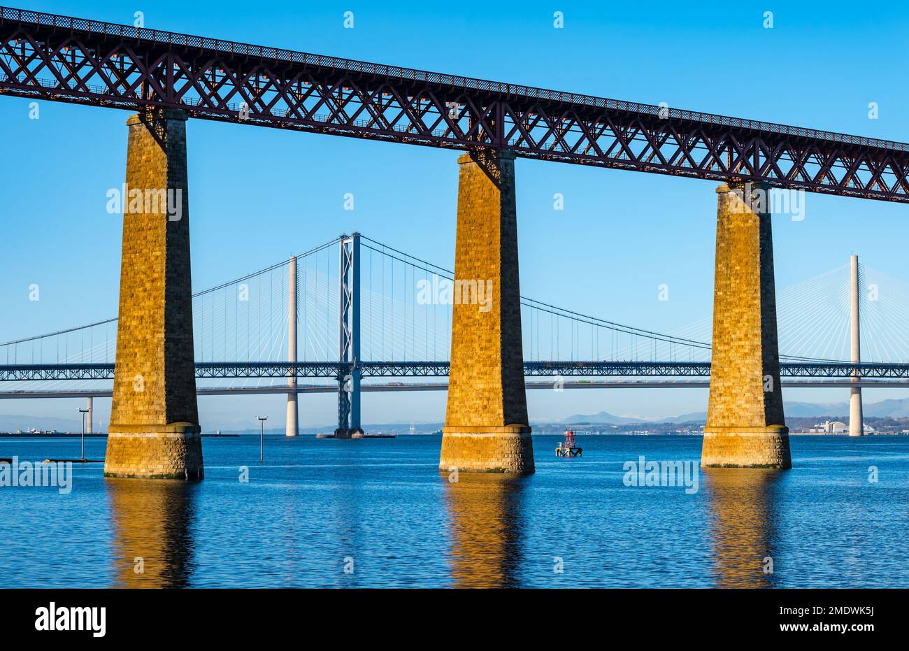 Forth bridges: Forth Rail bridge, Forth Road bridge and Queensferry Crossing on sunny day with clear blue sky, Firth of Forth, Scotland, UK Stock Photo