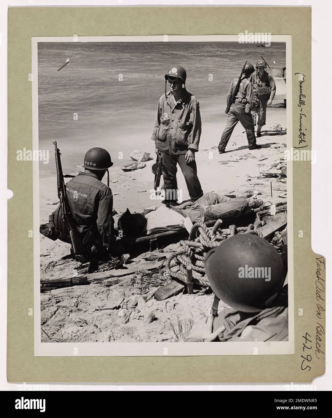 A Coast Guard-manned landing craft transports a wounded soldier to an ...