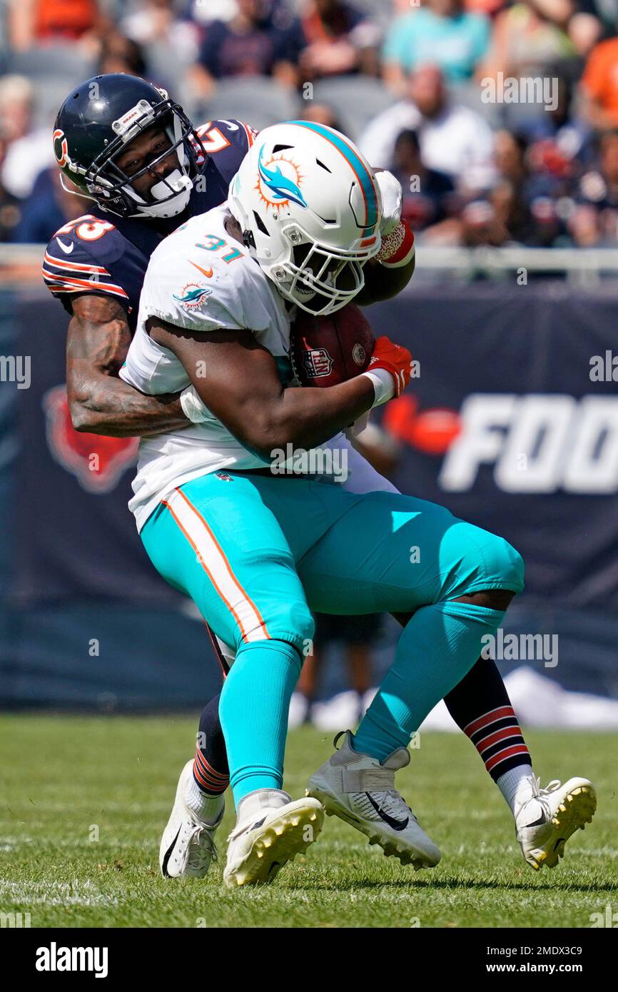 Chicago Bears strong safety Jordan Lucas (23) tackles Miami Dolphins  fullback Carl Tucker (31) during the