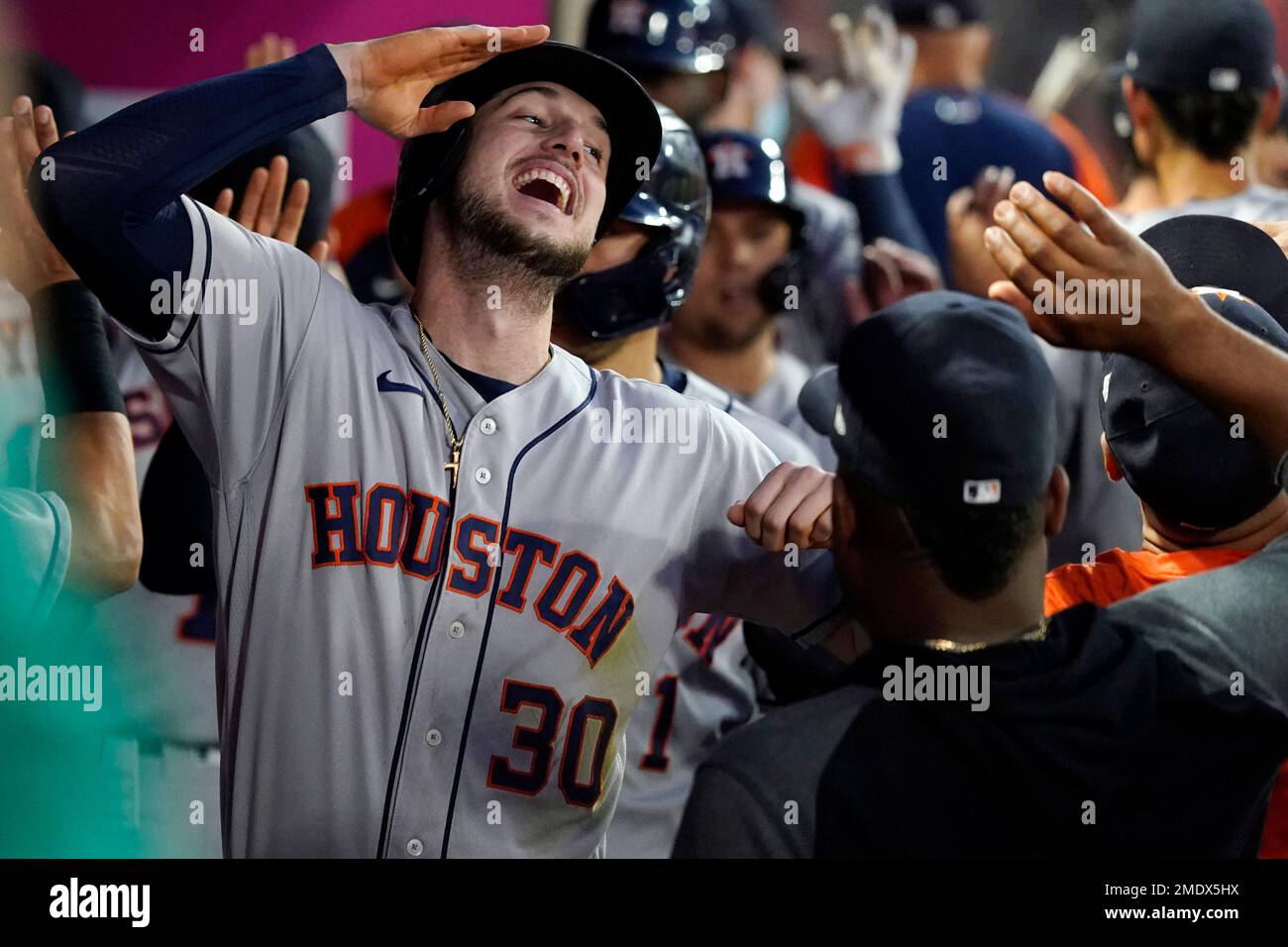 Houston Astros' Kyle Tucker gestures to the dugout as he celebrates his  double in the fourth inning of the team's baseball game against the Texas  Rangers in Arlington, Texas, Thursday, Sept. 16