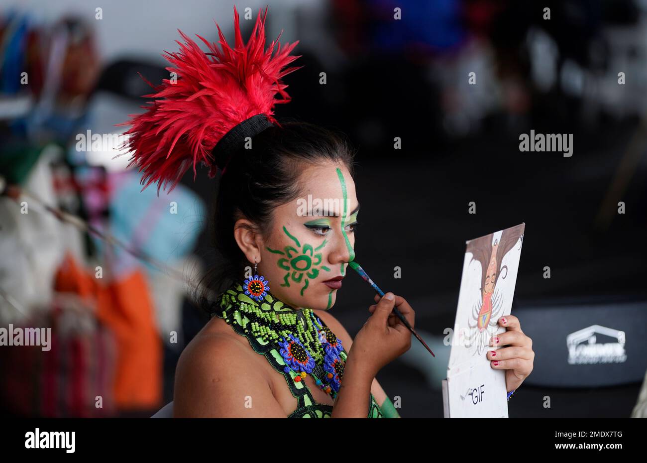 A dancer applies makeup prior to a ceremony to commemorate the 500th ...