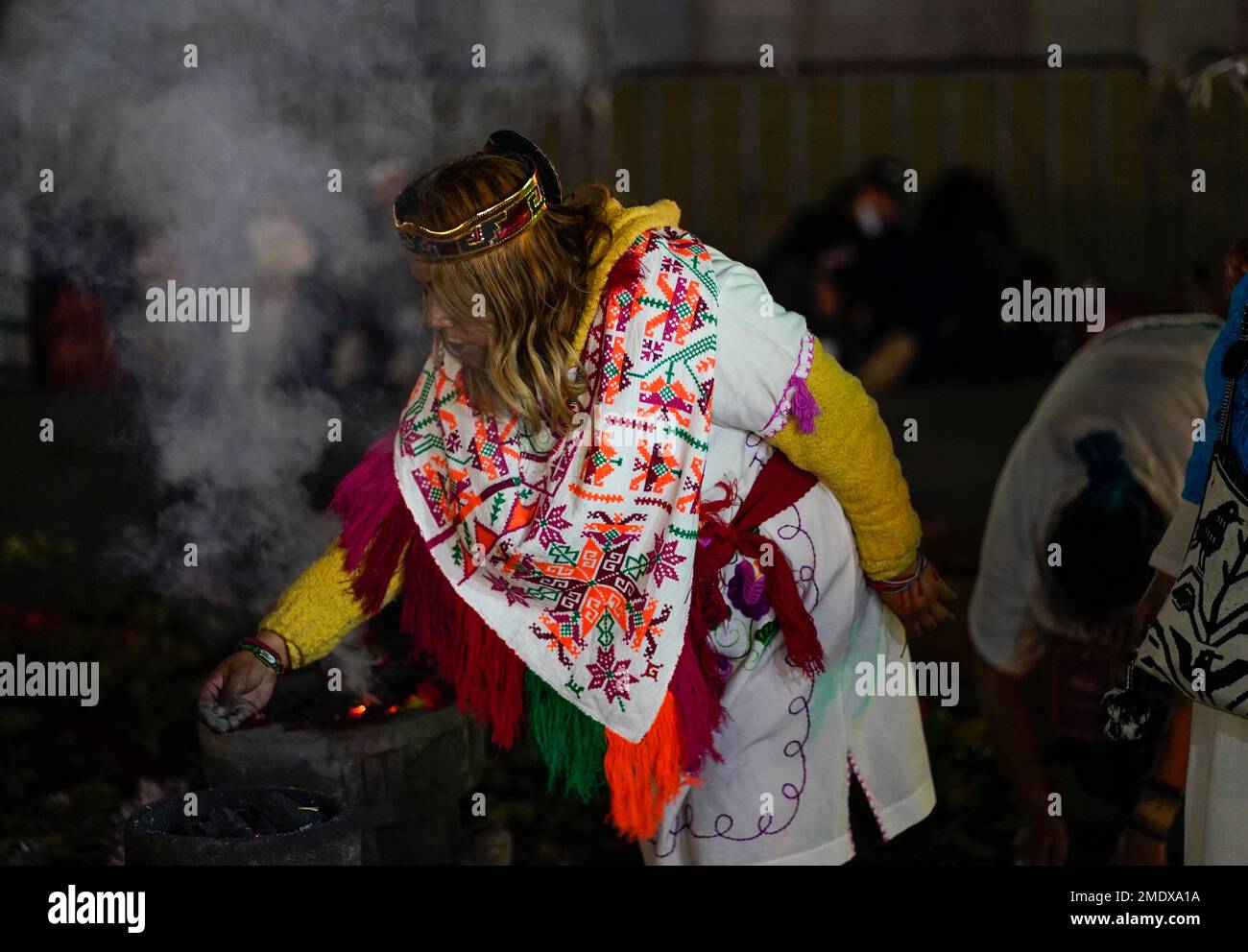 Mexican dancers burn incense during a ceremony to commemorate the 500th ...