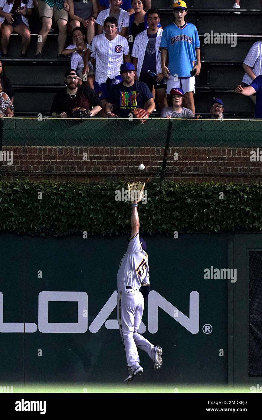 Tyrone Taylor of the Milwaukee Brewers catches a fly ball hit by