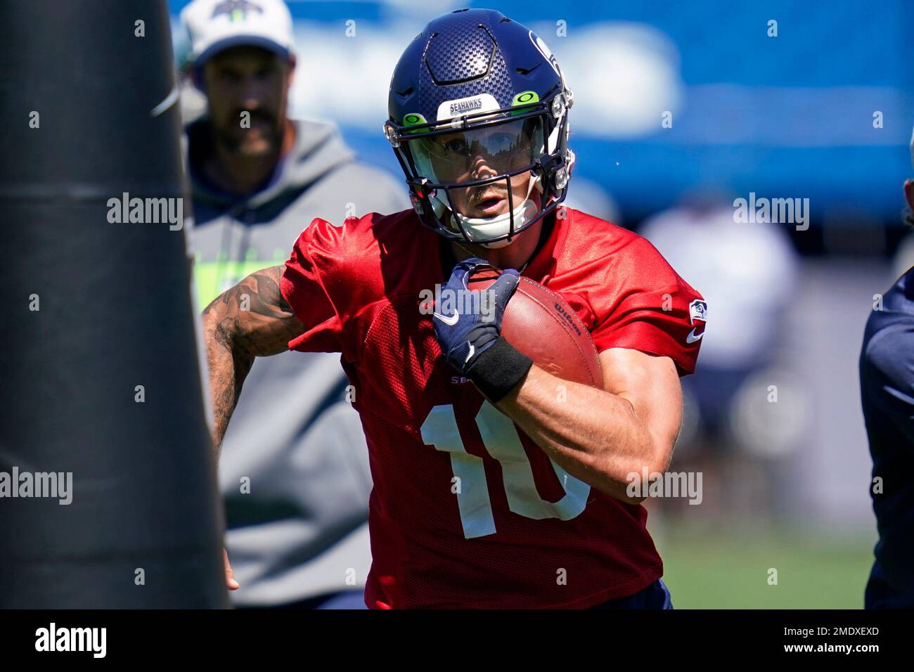 Seattle Seahawks quarterback Alex McGough (10) is tackled by Raiders  defensive end Solomon Thom …