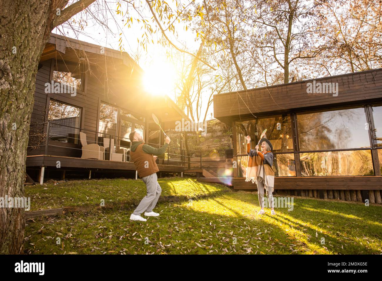 Mature couple playing badminton and looking involved Stock Photo