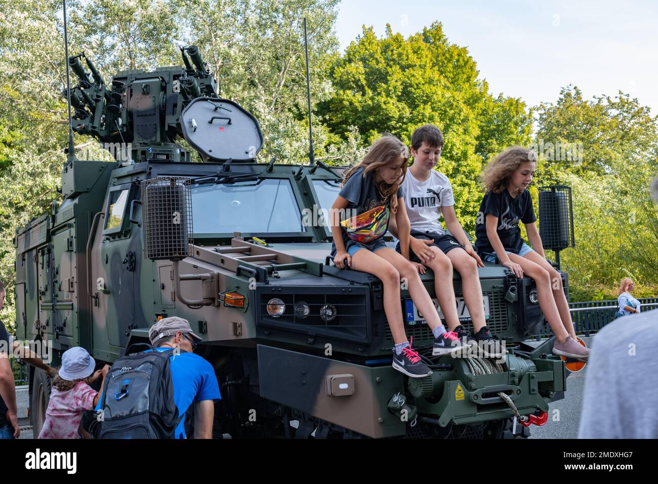 Warsaw, Poland - August 14, 2022 - Children on hood of Poprad self-propelled anti-aircraft missile system, short range air defense on Polish Army Day Stock Photo