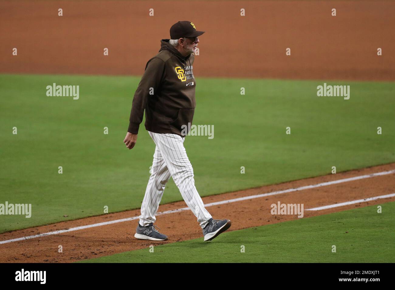 San Diego Padres pitching coach Larry Rothschild walks back to the ...