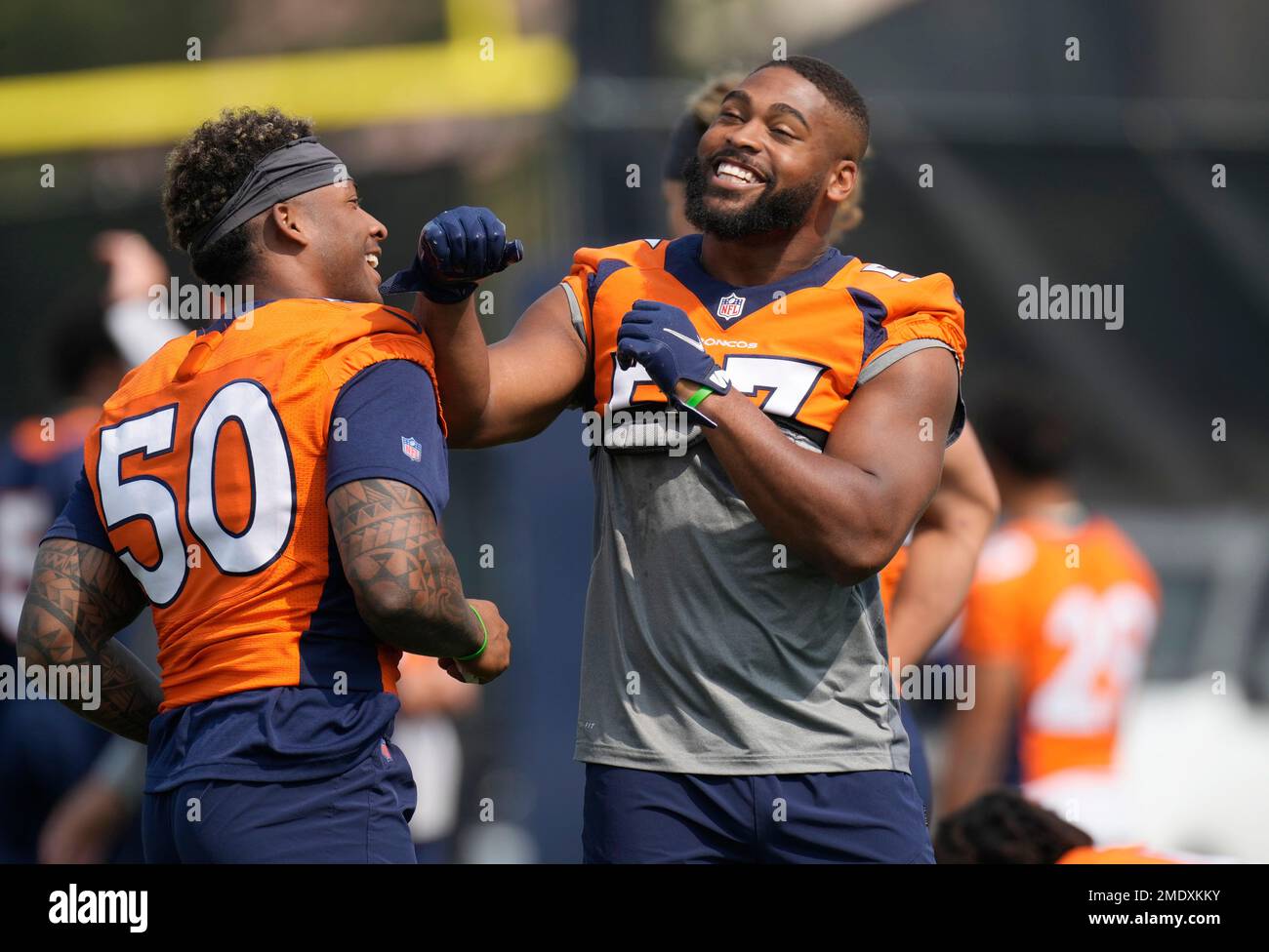 Denver Broncos linebacker Jonathon Cooper , left, and linebacker