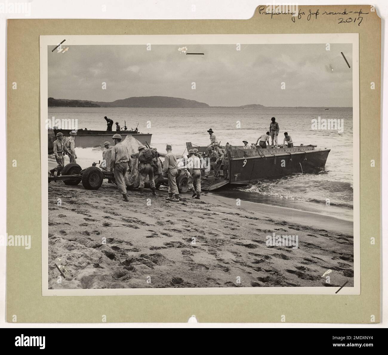 British and American troops, alongside U.S. Coast Guardsmen, unload ...