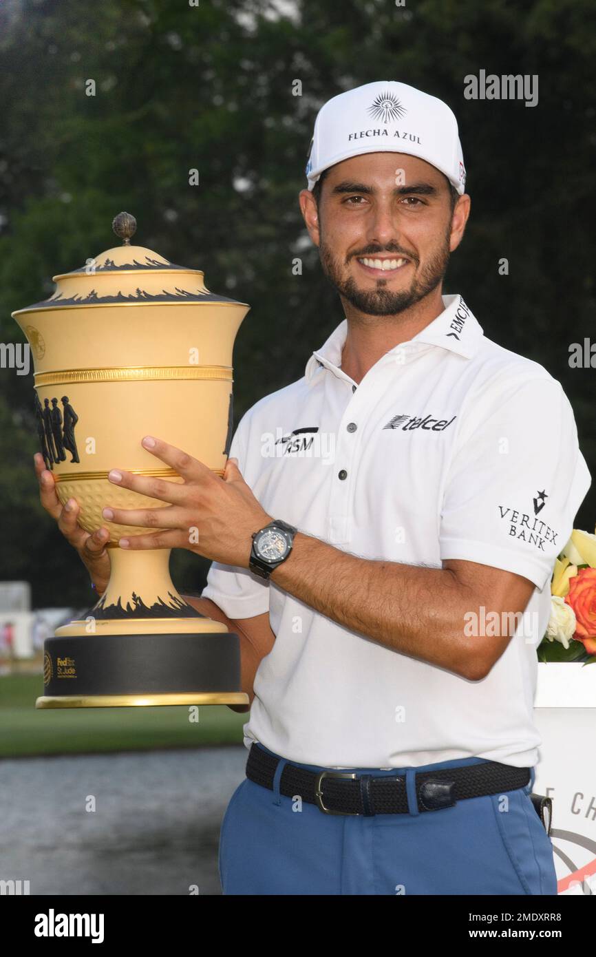 Abraham Ancer holds the trophy after winning the World Golf Championship-FedEx St. Jude Invitational tournament, Sunday, Aug