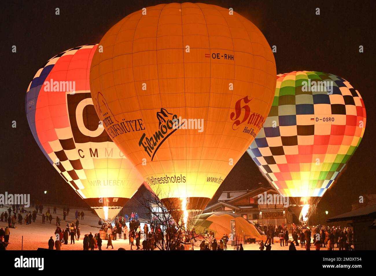 At the night of the balloons, the balloonists fire their balloons on the ground and create a colorful spectacle Stock Photo
