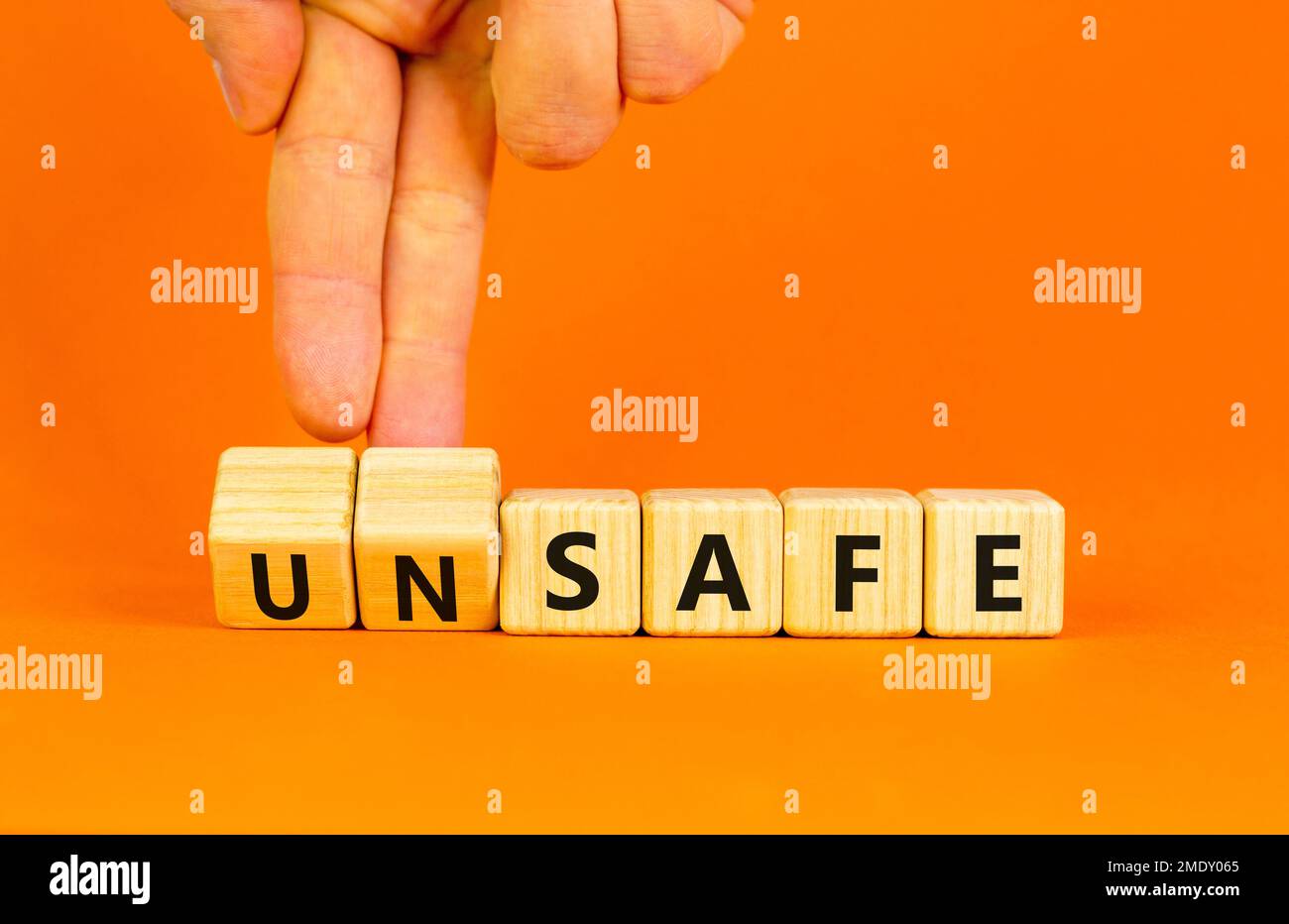 Safe or unsafe symbol. Concept word Safe Unsafe on wooden cubes