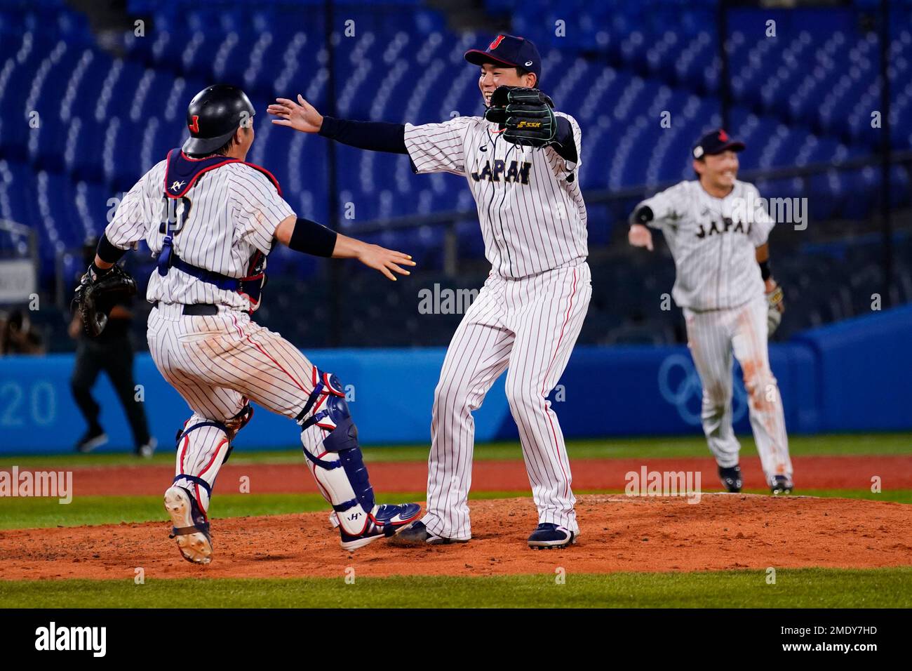 Japan's Takuya Kai, left, and Ryoji Kuribayashi celebrate after the