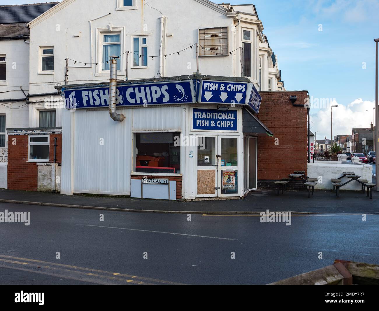 Blackpool Lancashire UK Jan 2023 traditional old fashioned seaside fish and chip shop Blackpool with blue signs Stock Photo