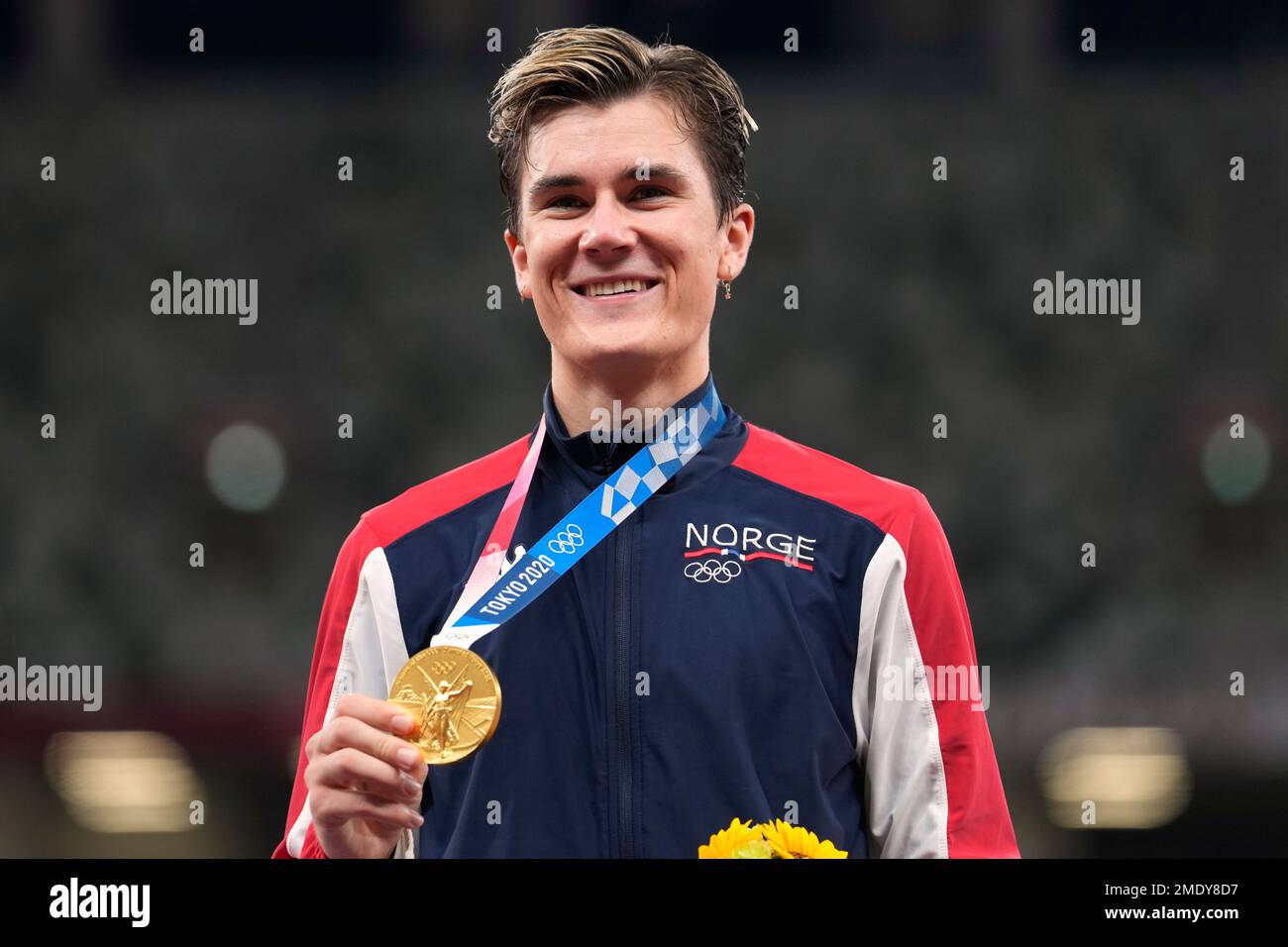 Gold medalist Jakob Ingebrigtsen, of Norway, celebrates on the podium