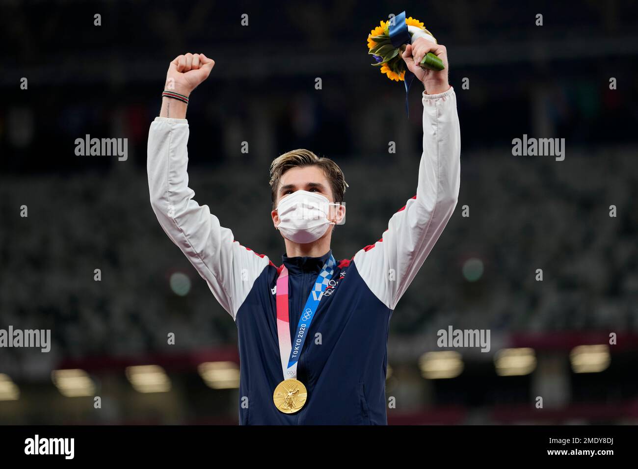 Gold medalist Jakob Ingebrigtsen, of Norway, celebrates on the podium