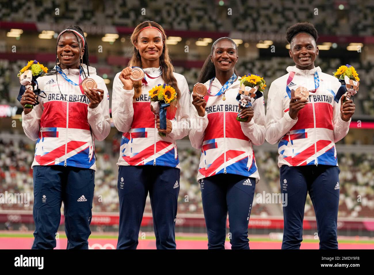 Bronze medalist, team Britain, poses during the medal ceremony for the