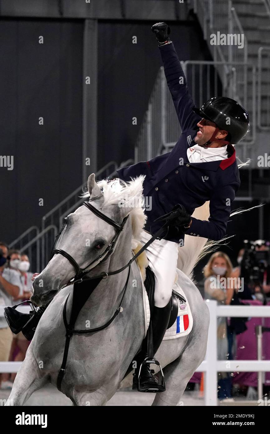 Frances Simon Delestre, riding, Berlux Z, celebrates after competing during the equestrian jumping team final at Equestrian Park in Tokyo at the 2020 Summer Olympics, Saturday, Aug