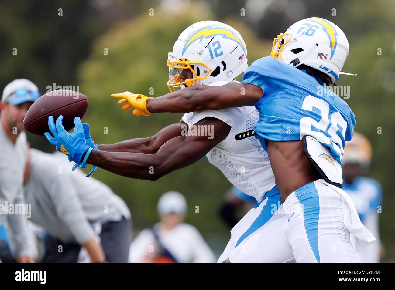 Los Angeles Chargers wide receiver Joe Reed, left, battles
