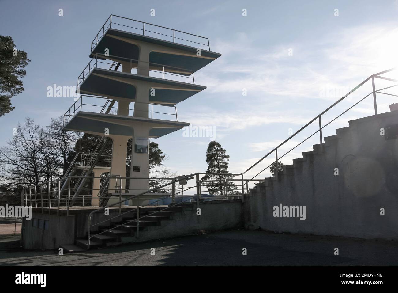 Public swimming pool shot empty in summertime. Old pool represents functionalism and was under a threat of demolition. Stock Photo