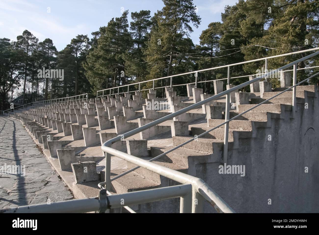 Public swimming pool shot empty in summertime. Old pool represents functionalism and was under a threat of demolition. Stock Photo