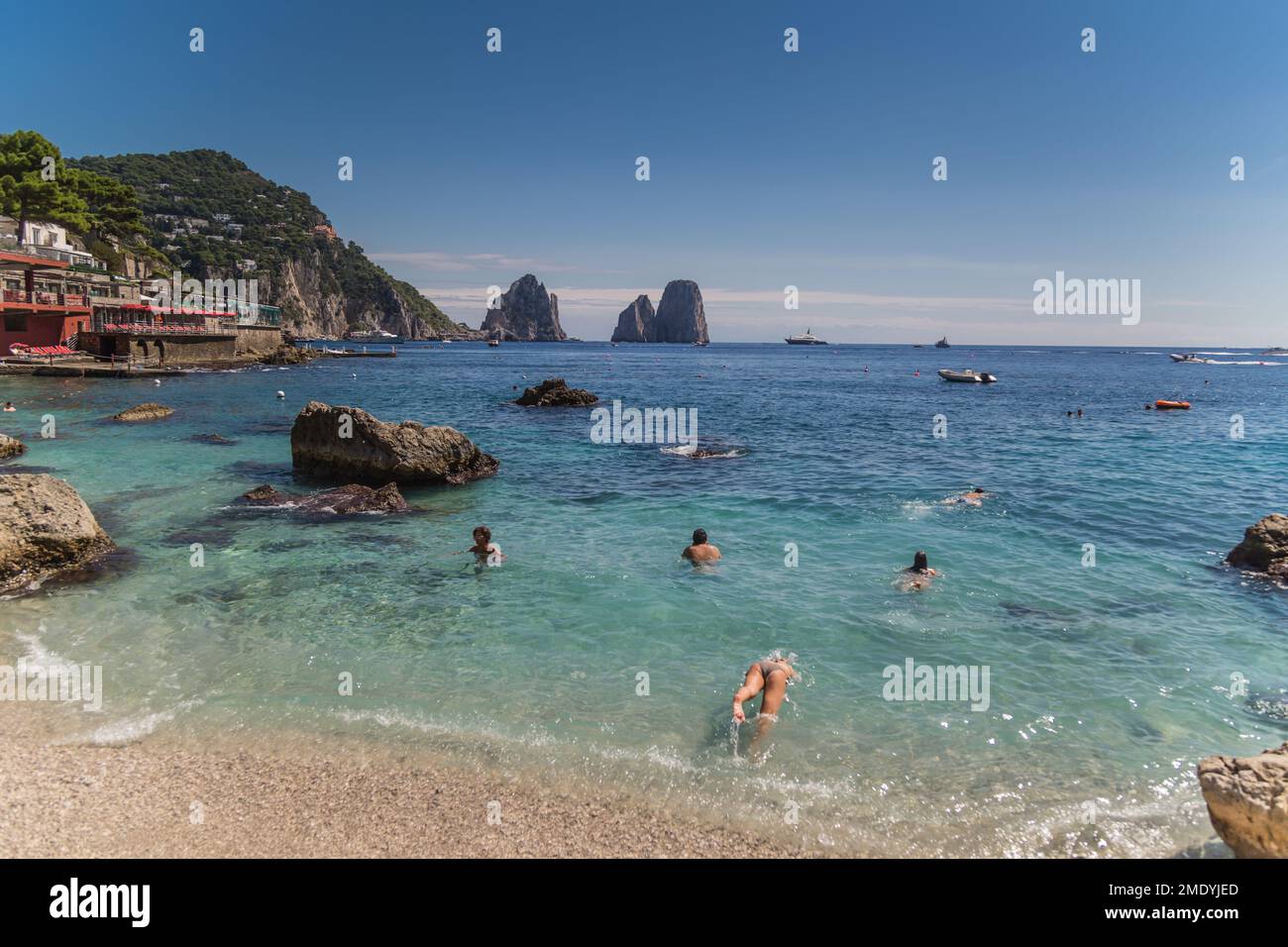 YOUNG INDIAN GIRLFAMILY OF FOUR CAPRI ISLAND, COAST, ITALY. ON CAPRI BEACH,  CAPRI ISLAND, COAST, ITALY Stock Photo - Alamy