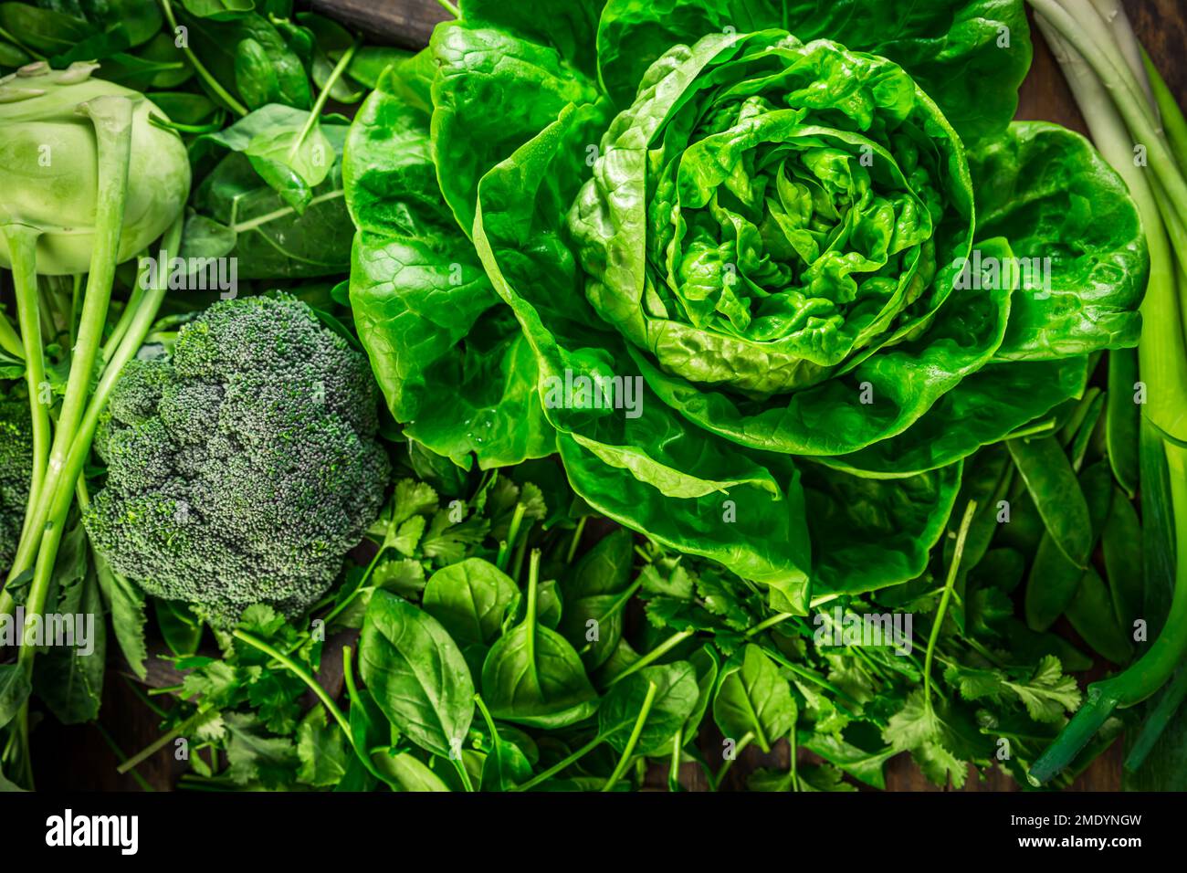 Green organic vegetables and dark leafy food background as a healthy ...