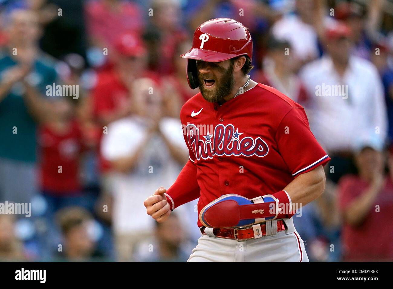 Philadelphia Phillies' Bryce Harper reacts as he scores on Rhys Hoskins'  double in the ninth inning of a baseball game against the Washington  Nationals, Thursday, Aug. 5, 2021, in Washington. Philadelphia won