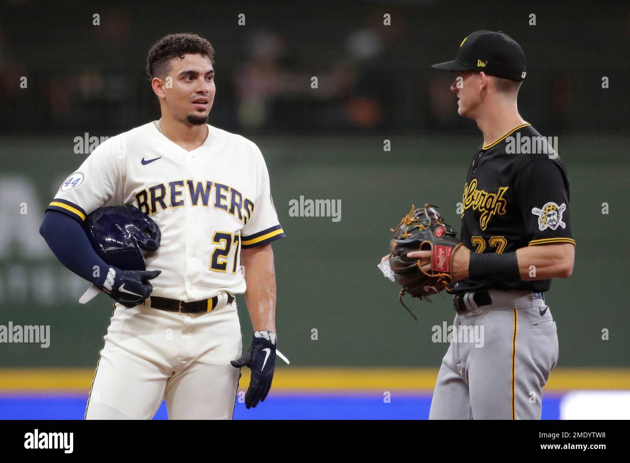 Milwaukee Brewers' Willy Adames, left, talks with Pittsburgh Pirates' Kevin  Newman, right, during the first inning of a baseball game Tuesday, Aug. 3,  2021, in Milwaukee. (AP Photo/Aaron Gash Stock Photo - Alamy