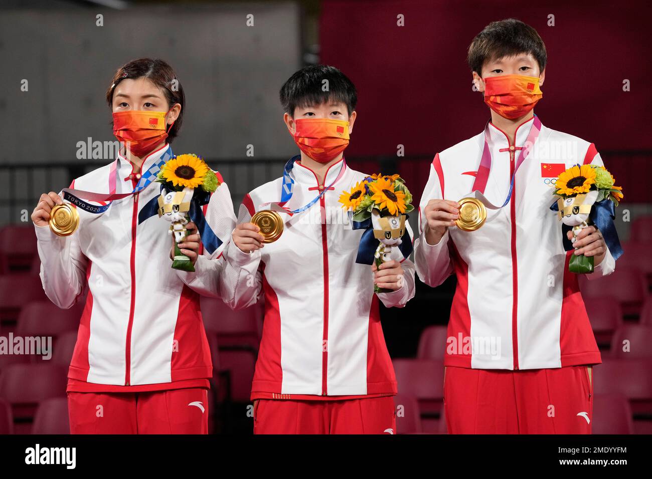 From left, gold medalists Chen Meng, Sun Yingsha, and Wang Manyu of