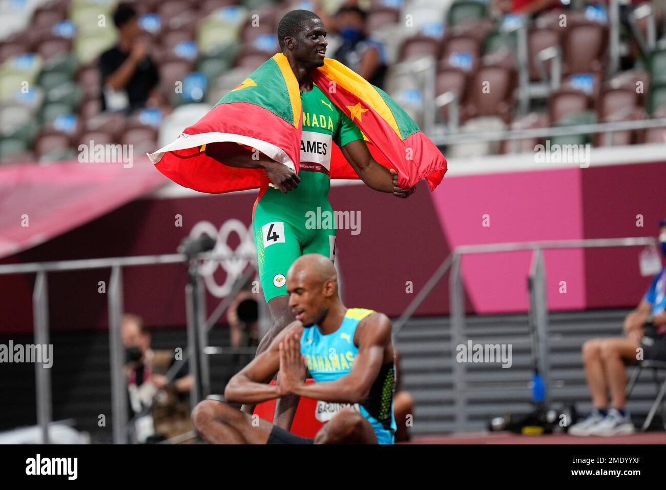 Kirani James, of Grenada, celebrates after winning the bronze medal in