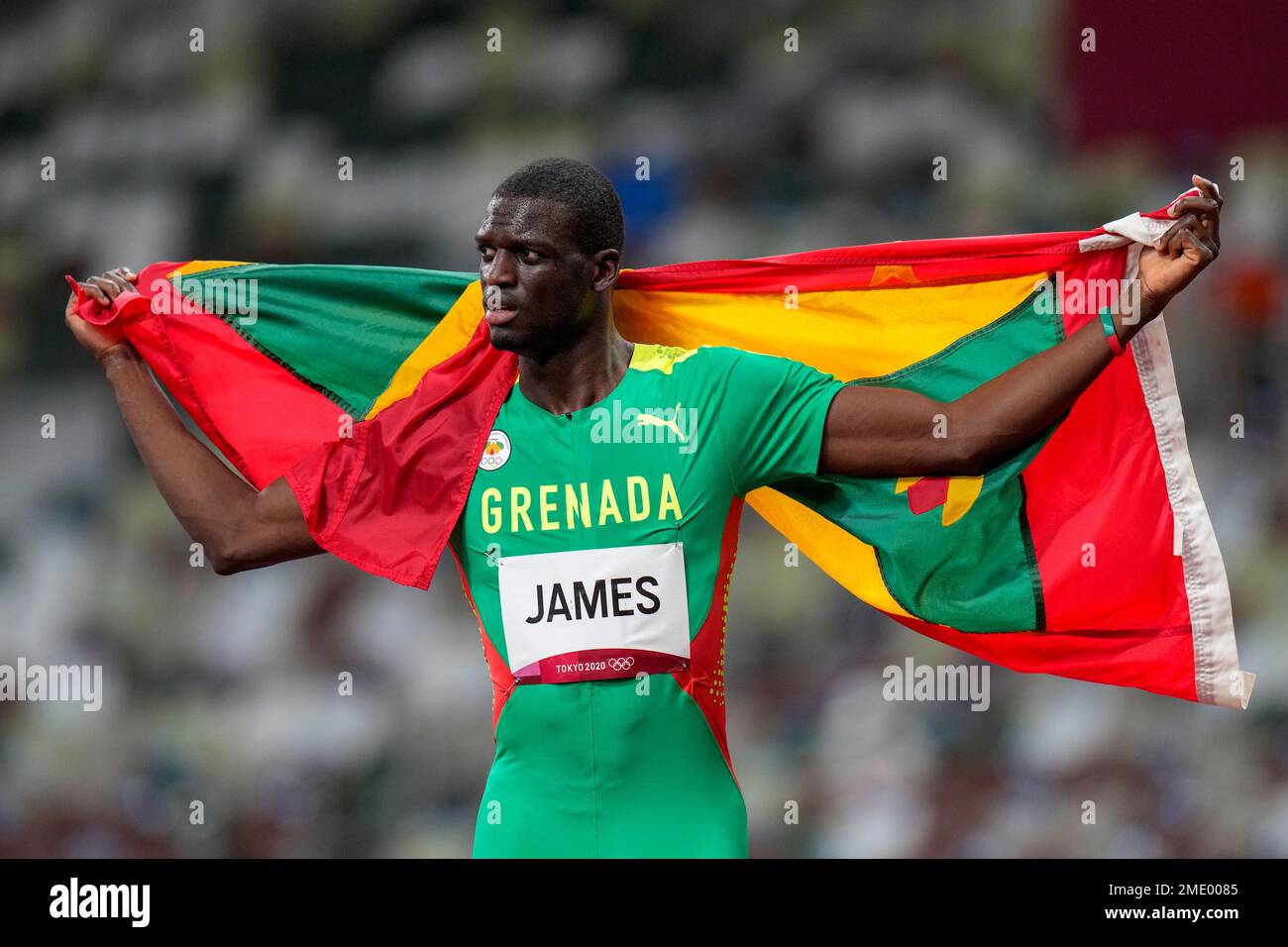 Kirani James, of Grenada, celebrates after winning the bronze medal in