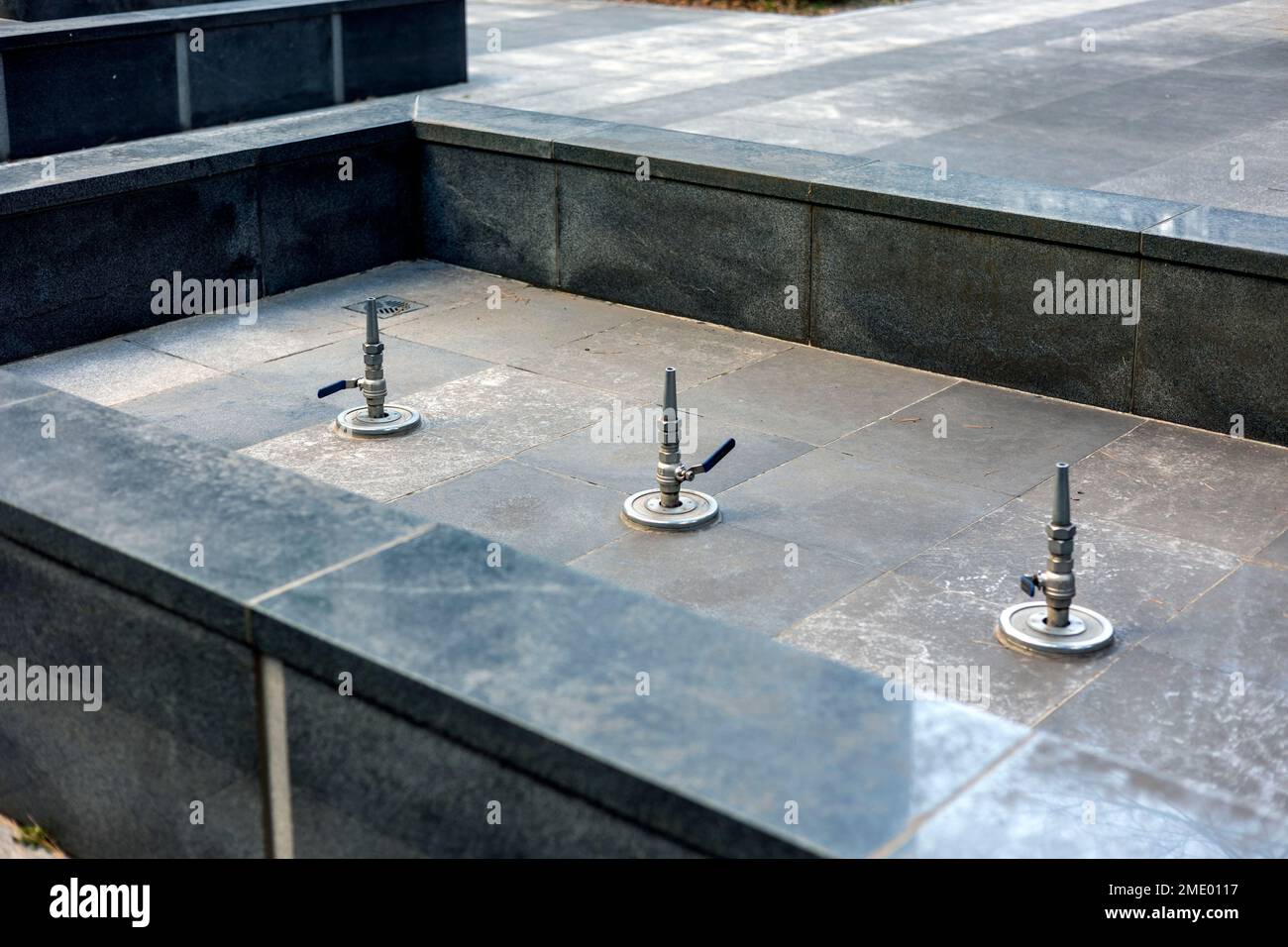 Fountain pipes in a drained empty pool Stock Photo Alamy
