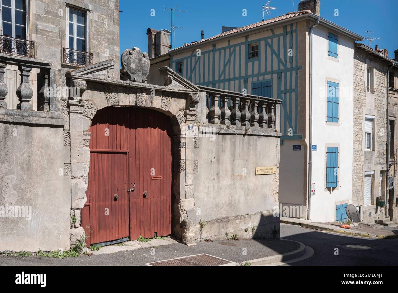 France provincial street, view of a late 17th century walled gate and a half timbered domestic property in the historic provincial town of Joinville Stock Photo