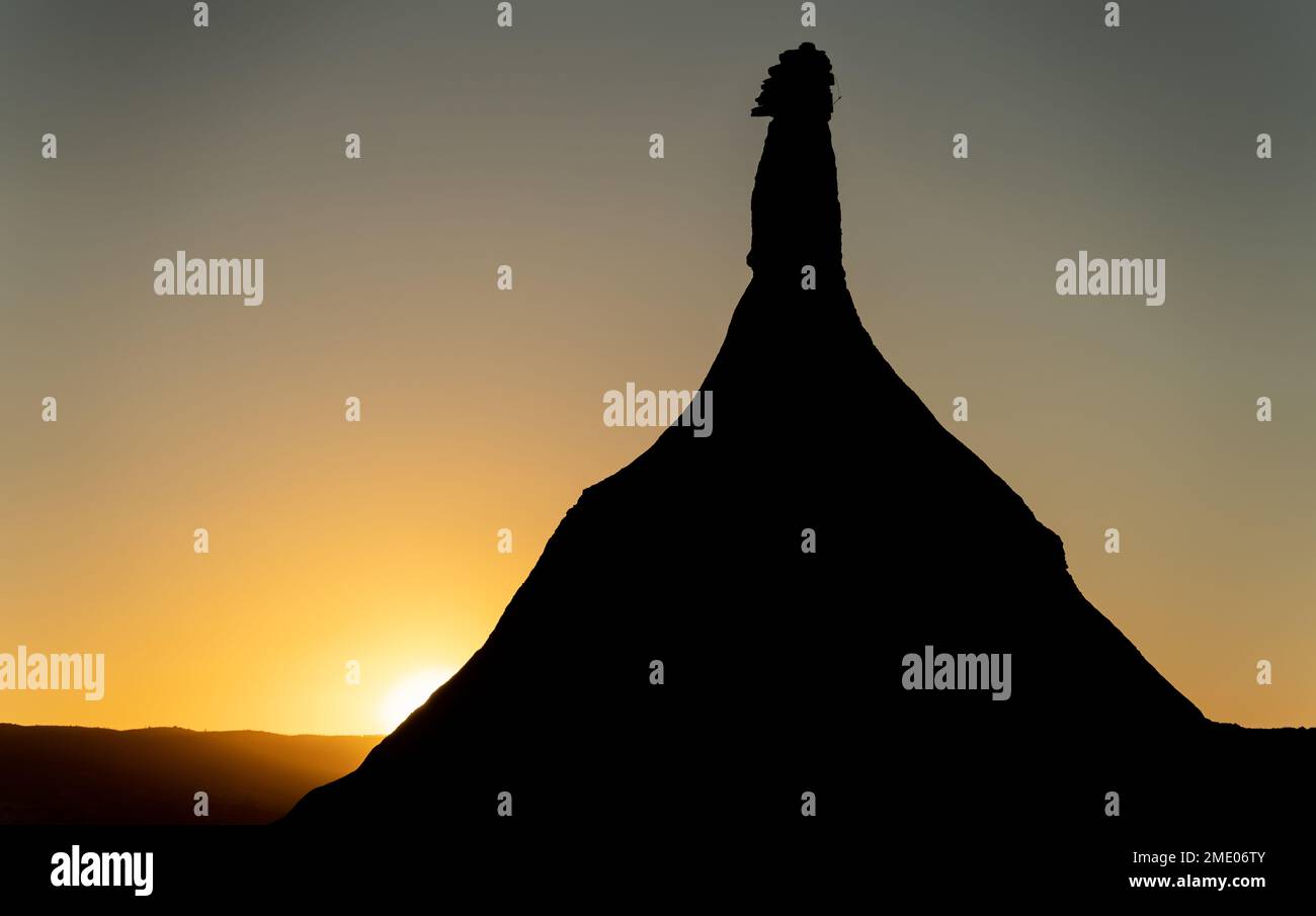 Castil de Tierra backlit at dusk in Bardenas desert Stock Photo