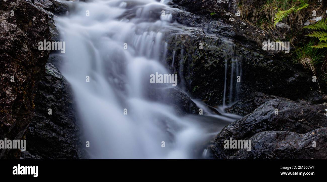 A small waterfall on the way to Cadair Idris National Park Snowdonia in ...