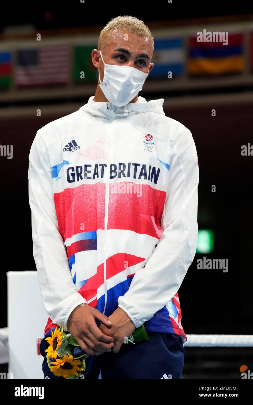 Silver medalist Britain's Benjamin Whittaker stand during the medal