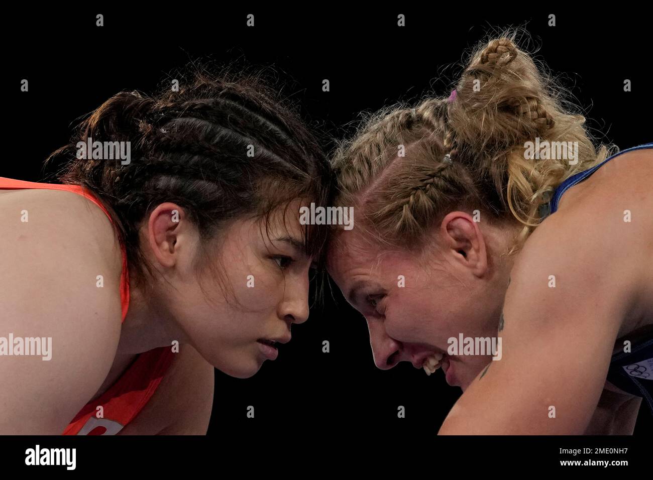 Japan's Sara Dosho, left, and Ukraine's Alla Cherkasova compete during