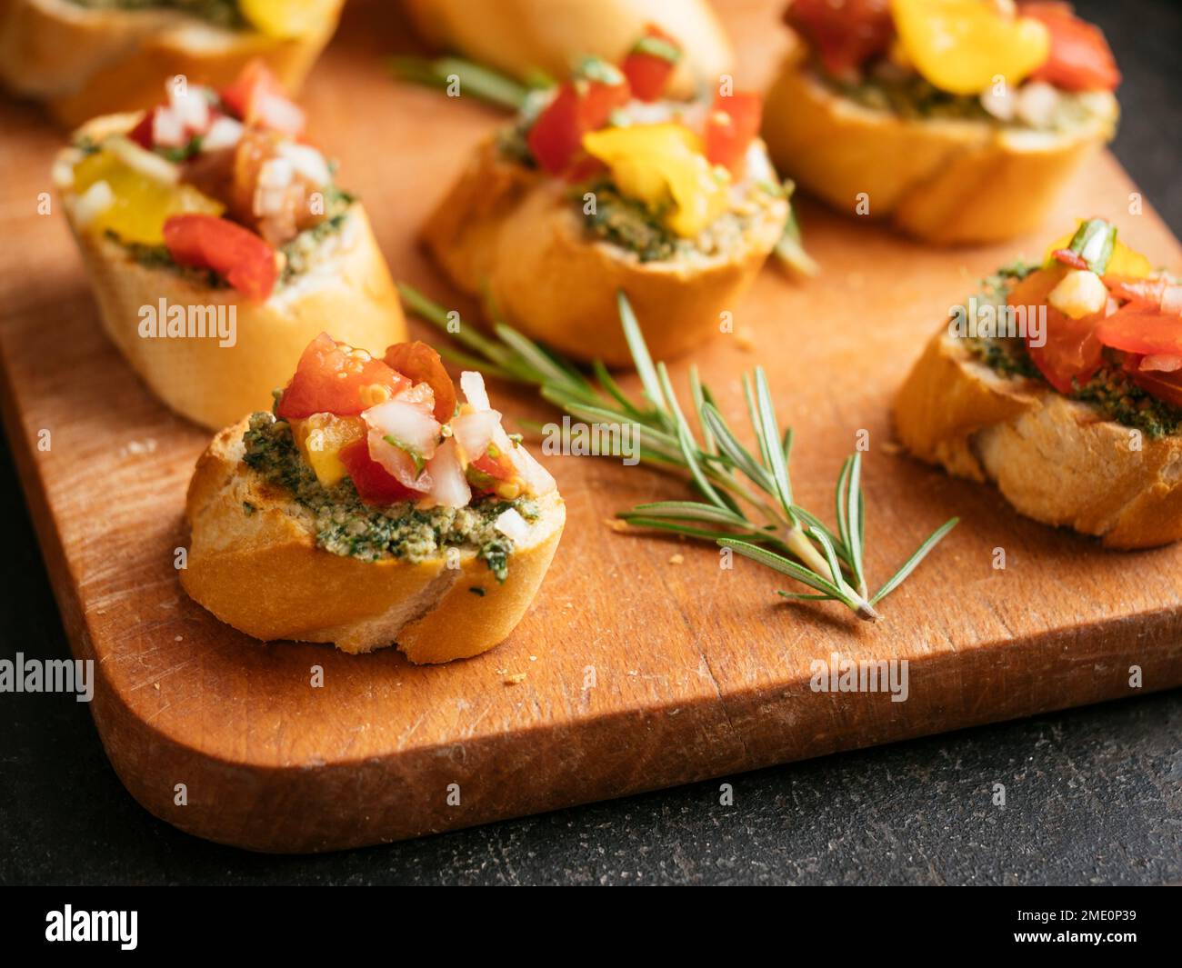 Bruschetta with carrot green pesto and shopped tomatoes Stock Photo Alamy