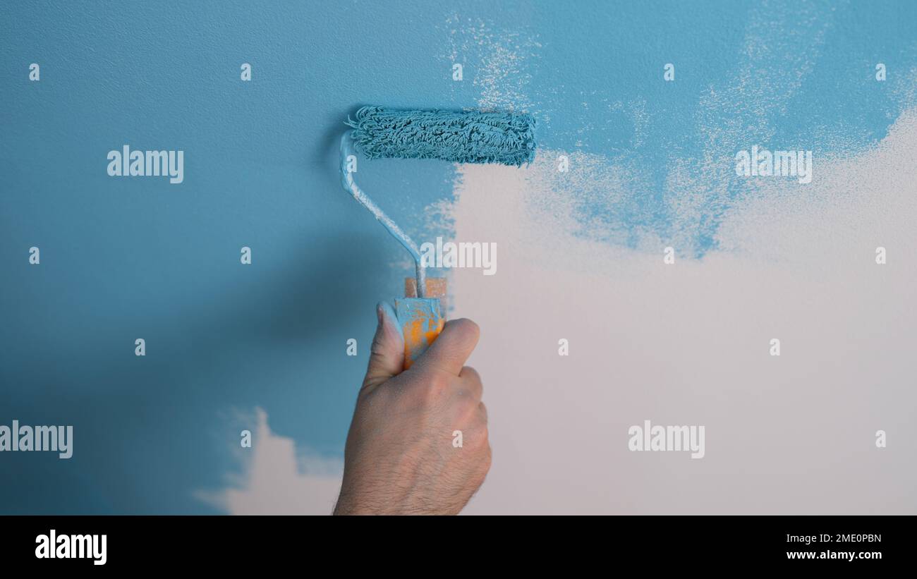 Male hand paint roller hi-res stock photography and images - Alamy